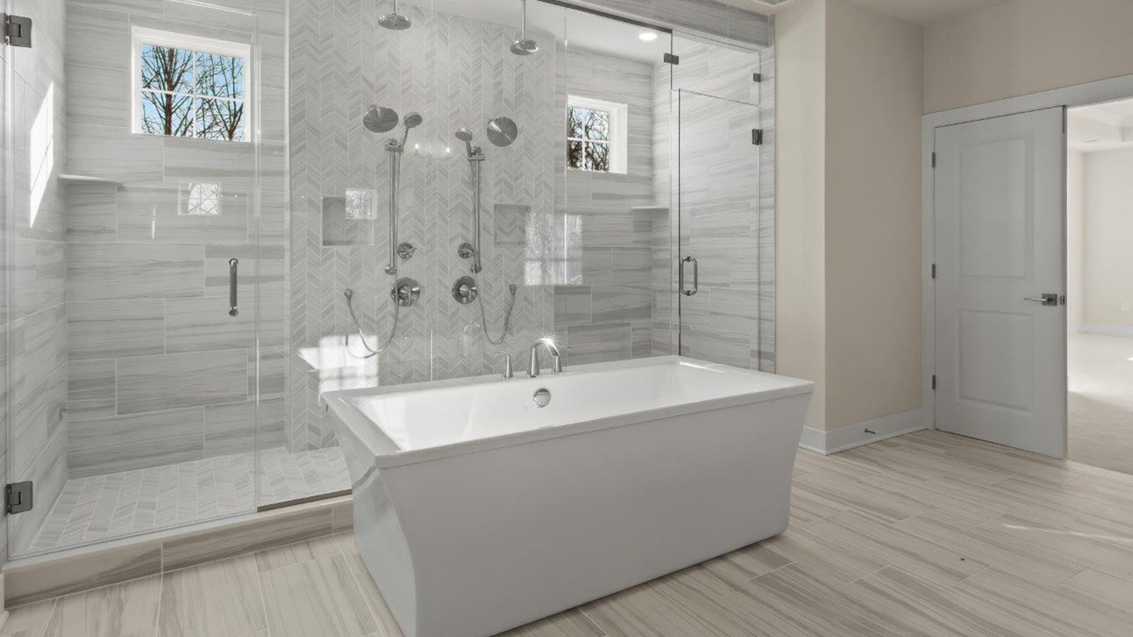 central soaking tub and large glass shower