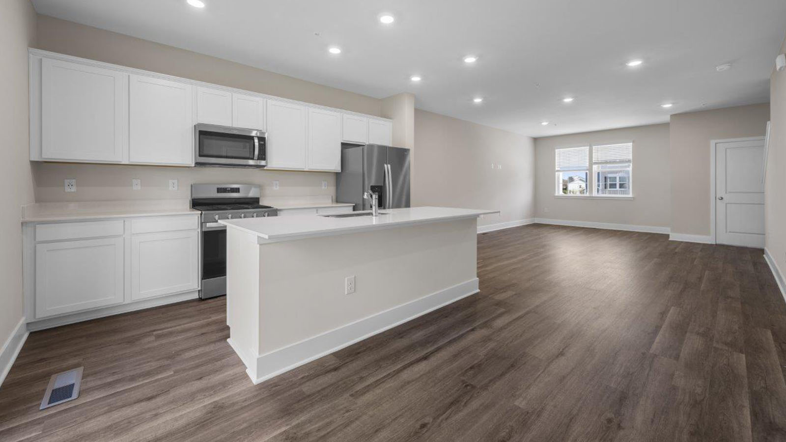 main level kitchen with white shaker styel cabinets