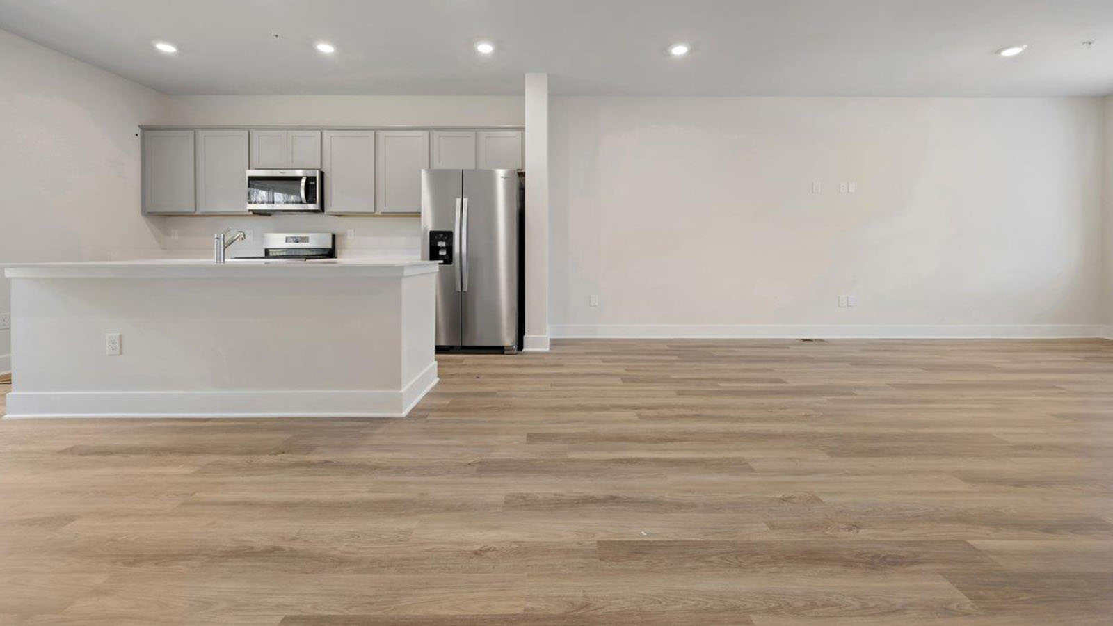 open concept kitchen leading into living