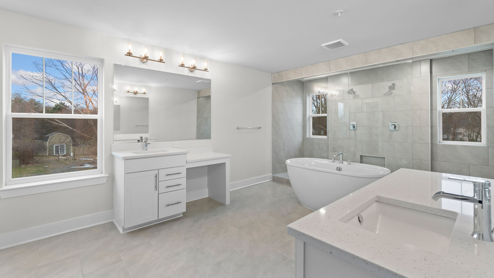 central soaking tub and dual vanities