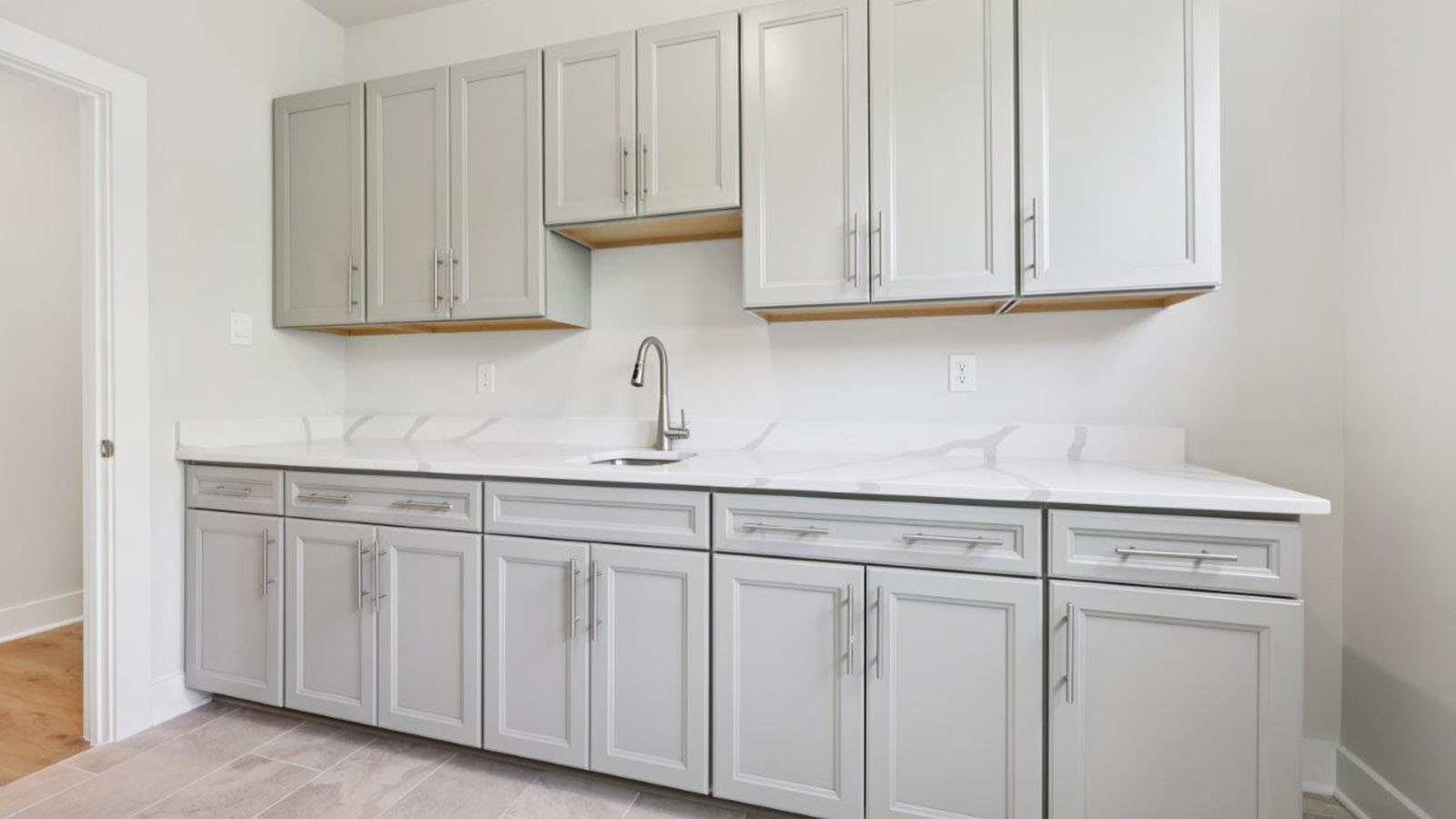 laundry room with cabinets and folding counter