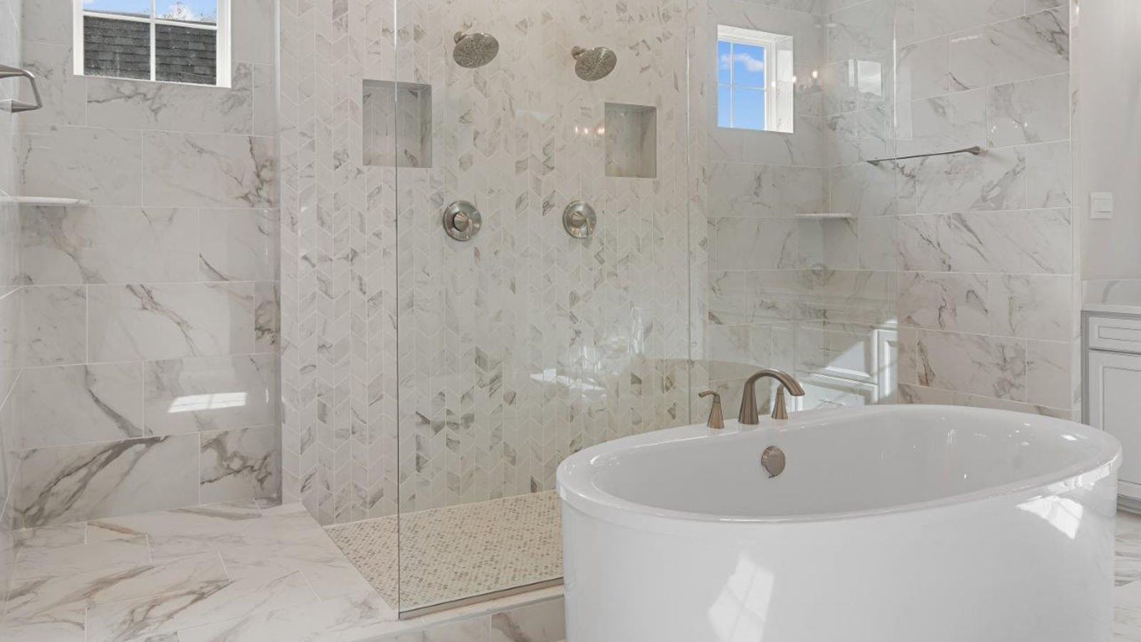 master bathroom with soaking tub and shower