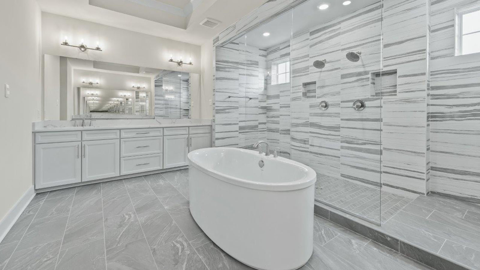 tub in front of large glass shower