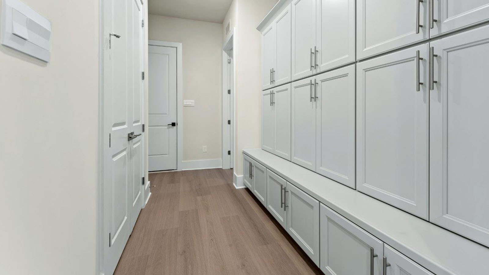 drop zone with ample cabinets and bench