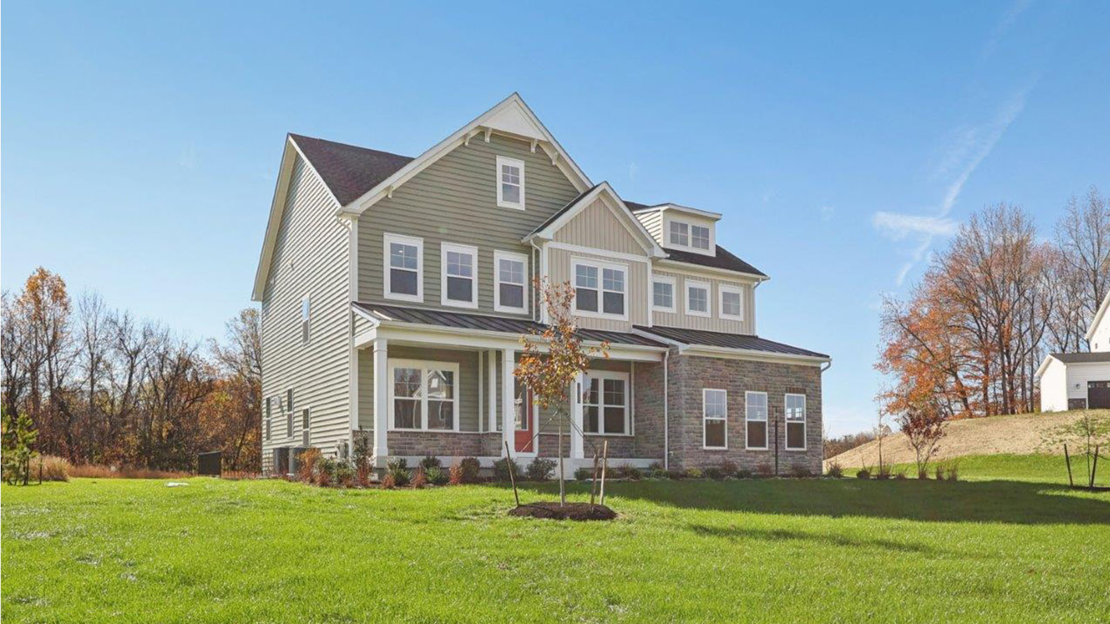 front elevation with porch and multi car garage
