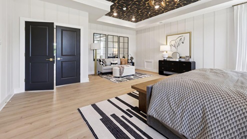 master bedroom with tray ceiling