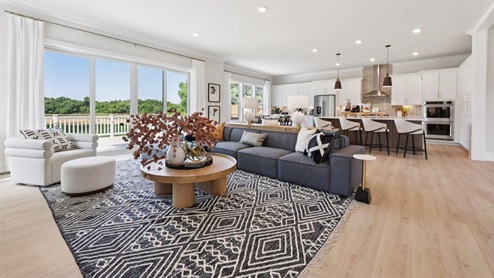 open concept living room facing fireplace