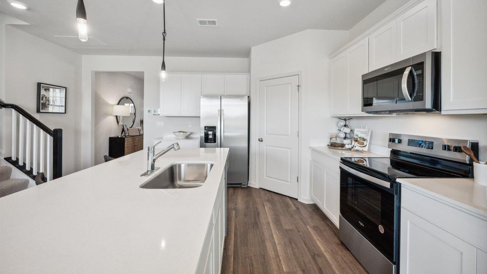 kitchen with shaker cabinets and quartz counters