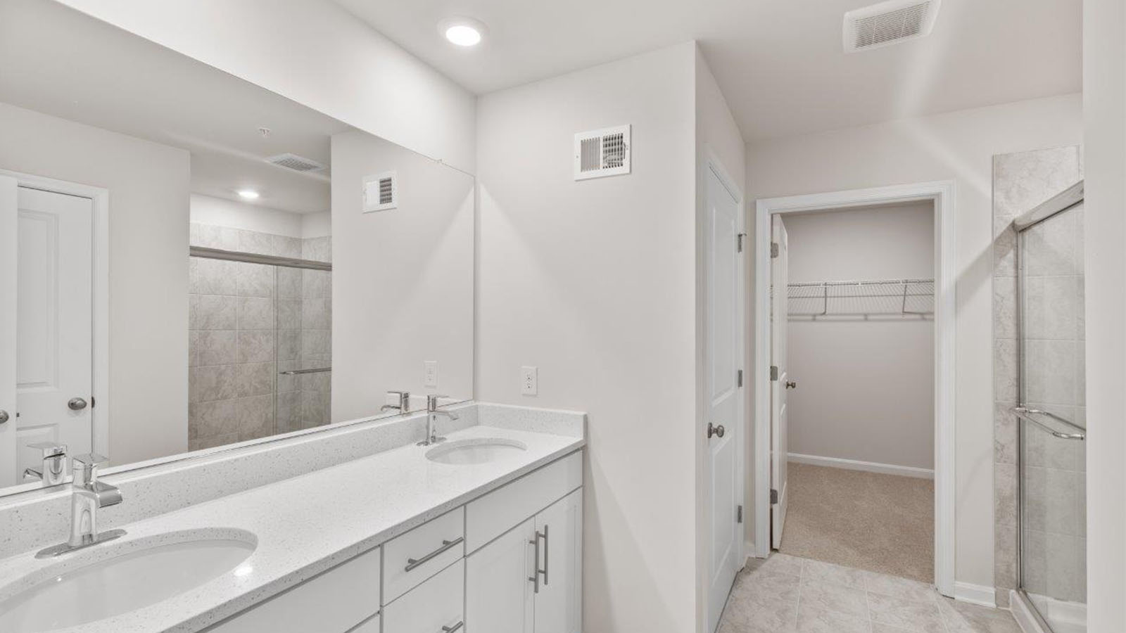 master bathroom with dual vanities
