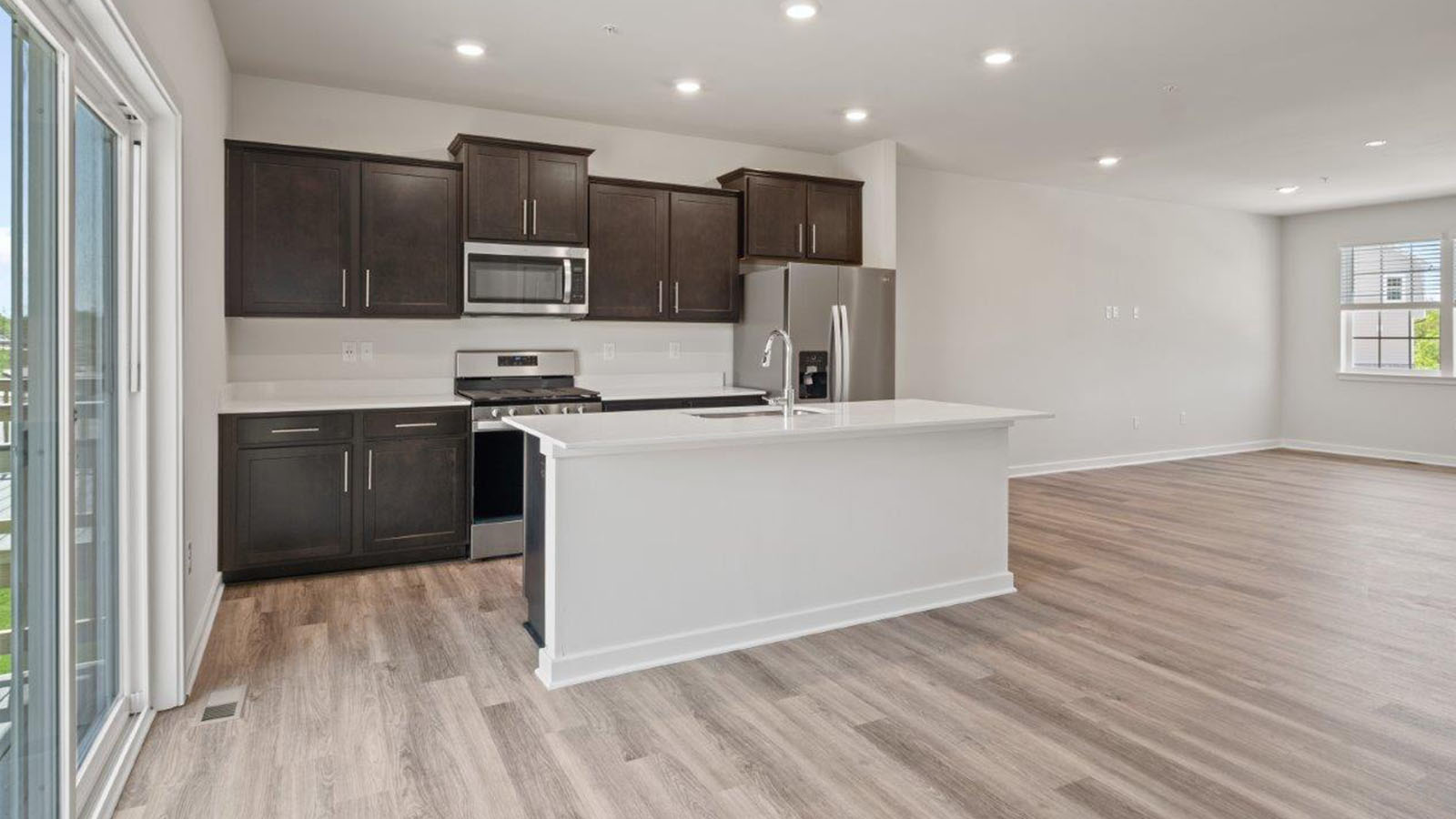 kitchen with shaker style cabinets and quartz counters