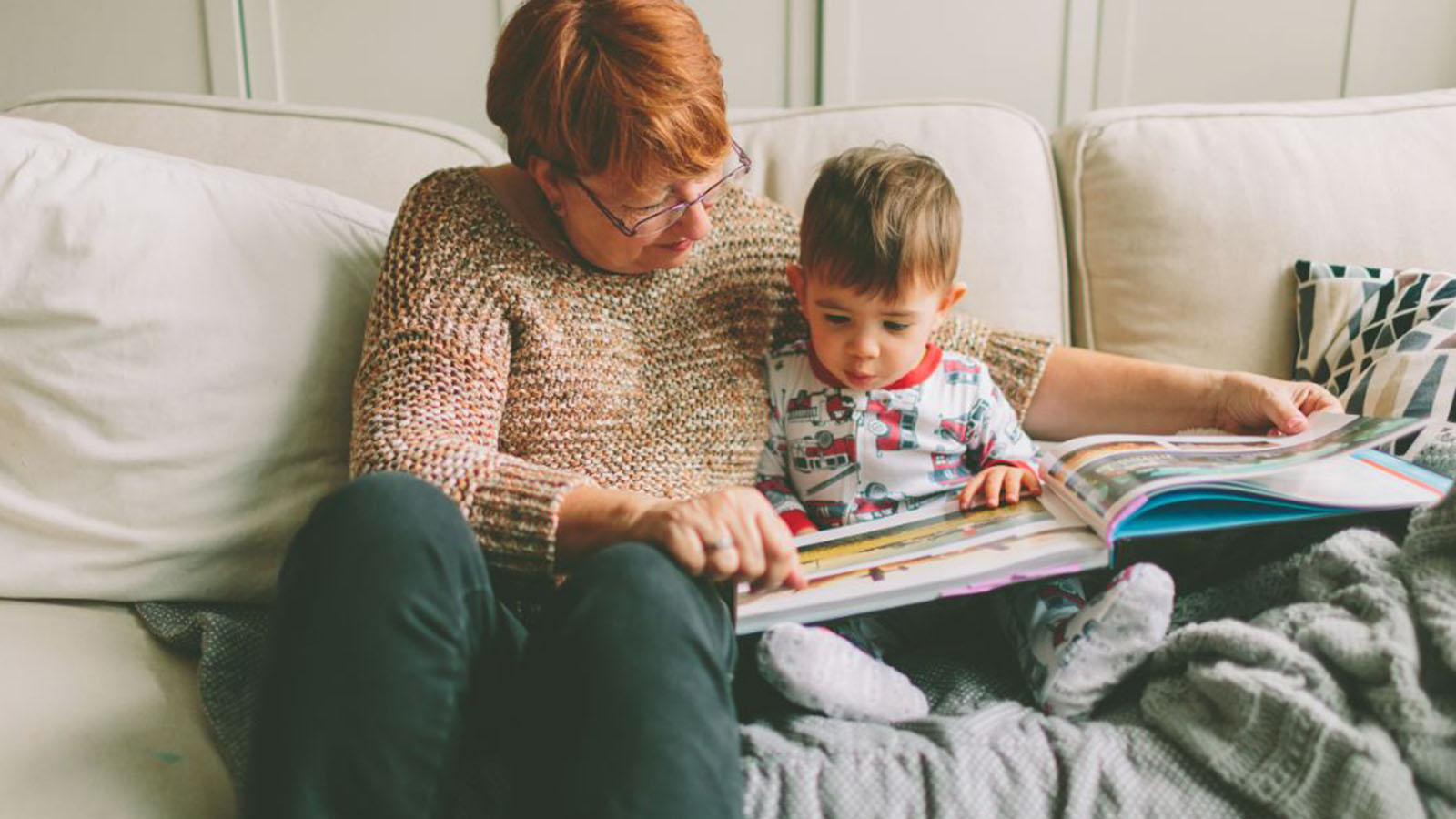 grandmother reading to grandson