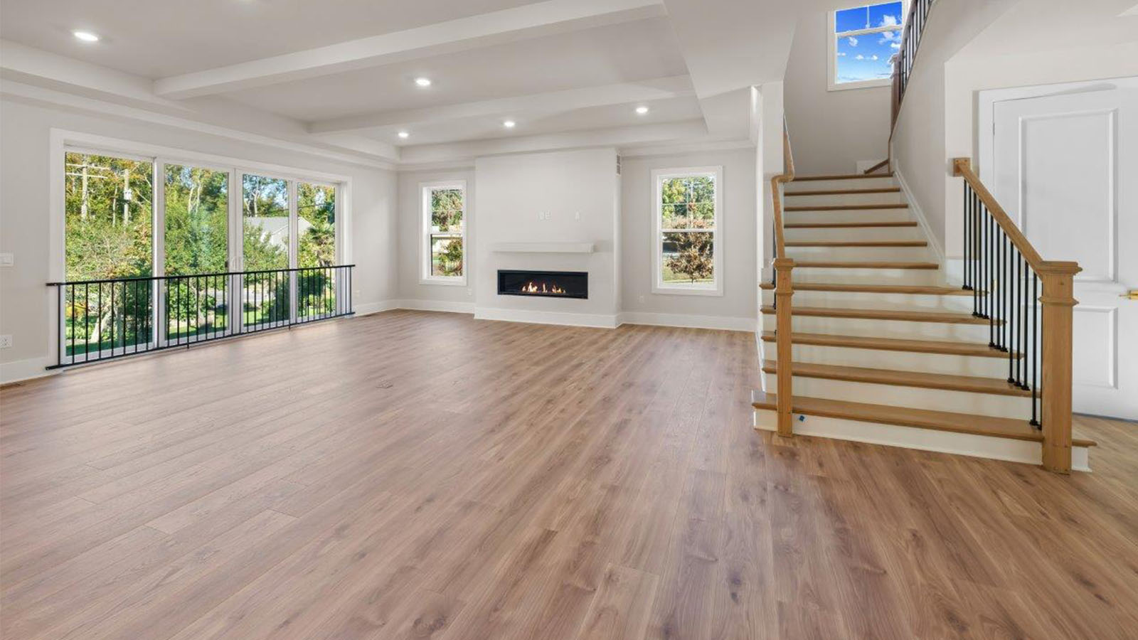 open concept living room facing linear fireplace