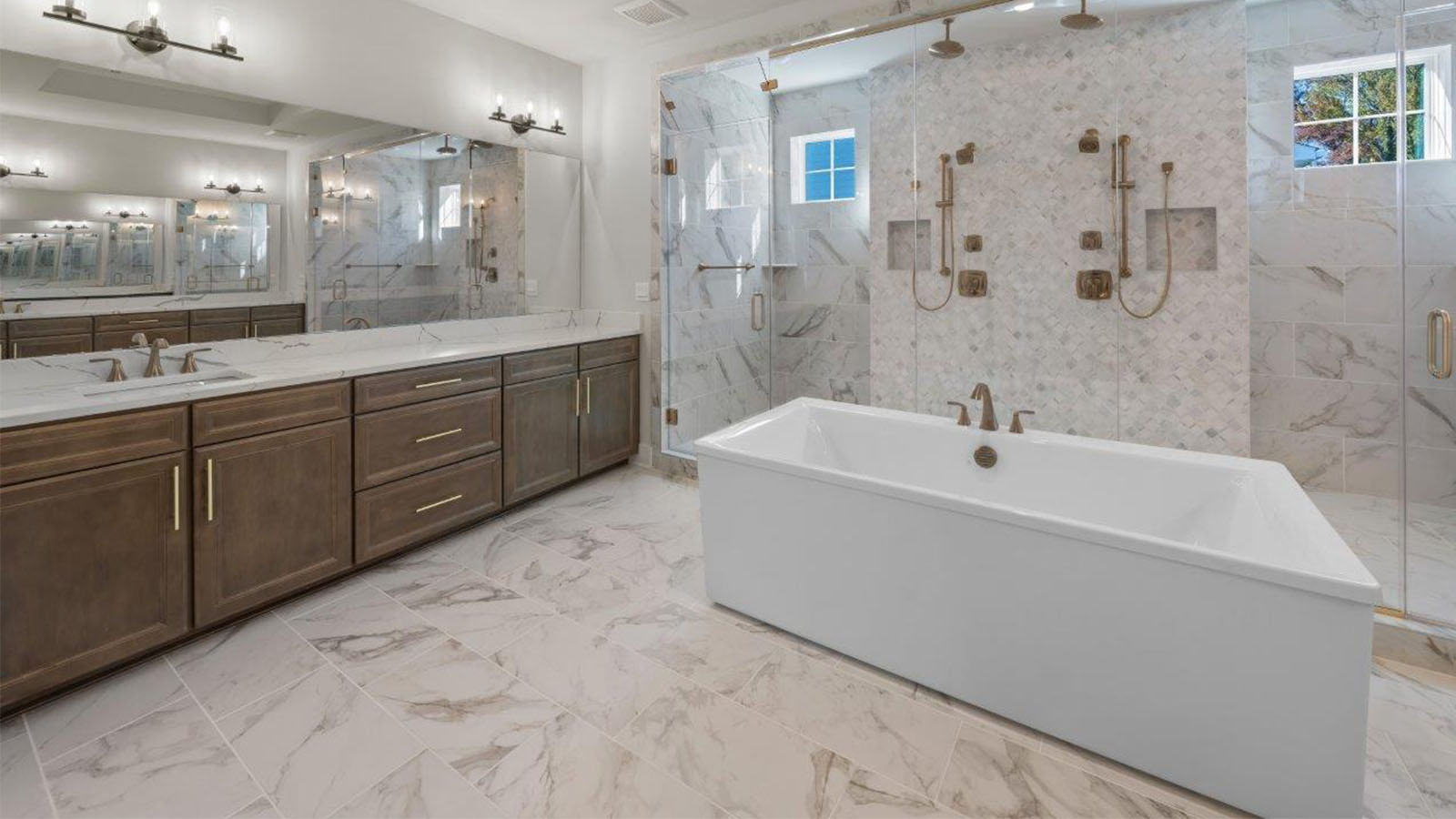 mater bathroom with central soaking tub and glass shower