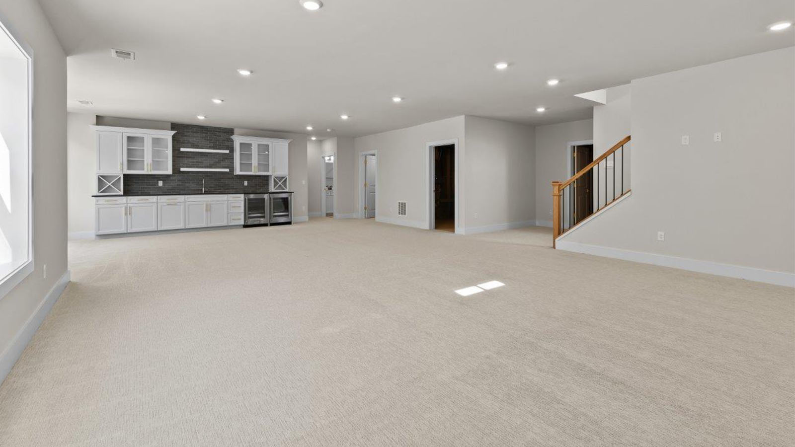 finished basement rec room with mini kitchen