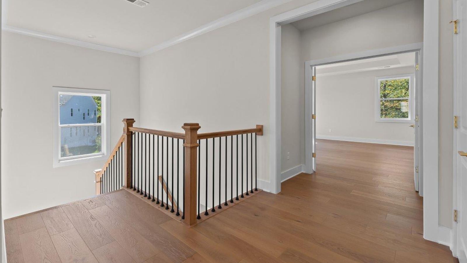upstairs hard surface flooring leading into master bedroom