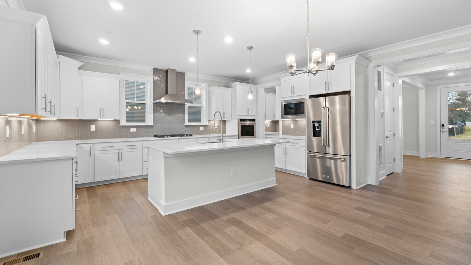 spacious kitchen with central quartz island