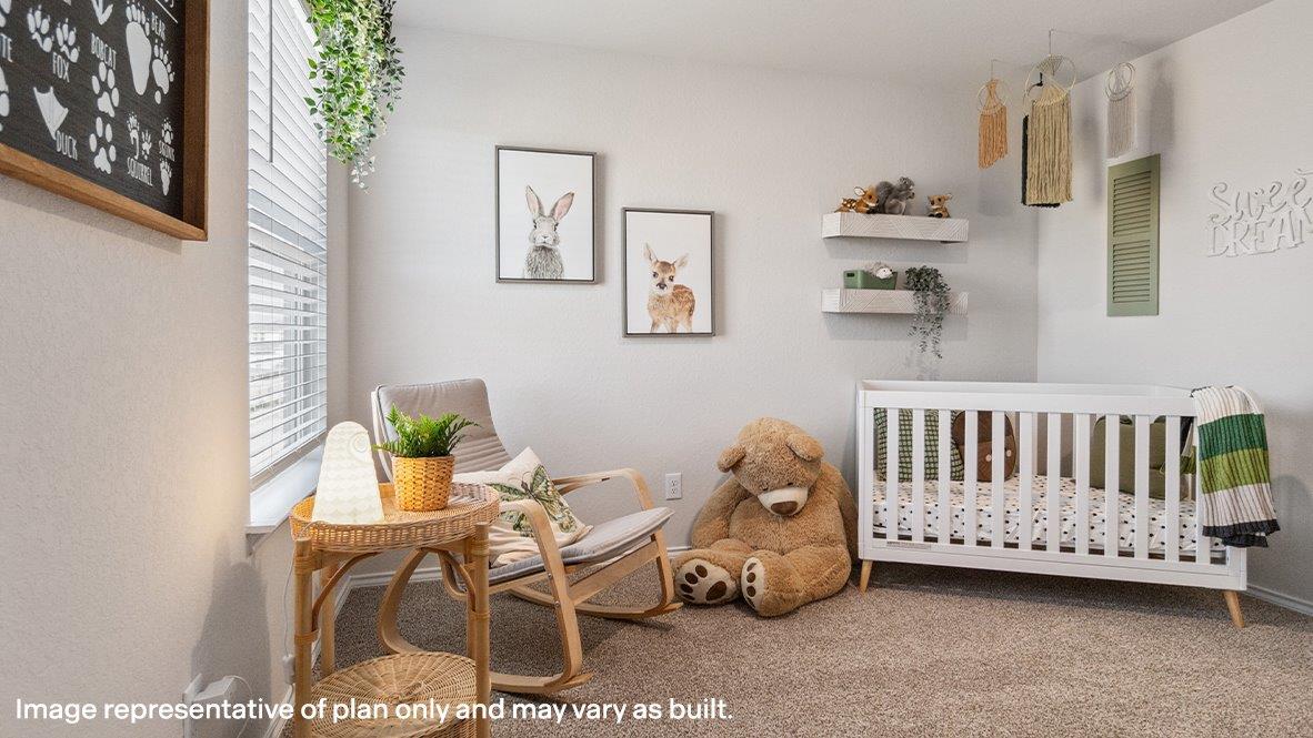 Secondary bedroom with carpet, closet and window.