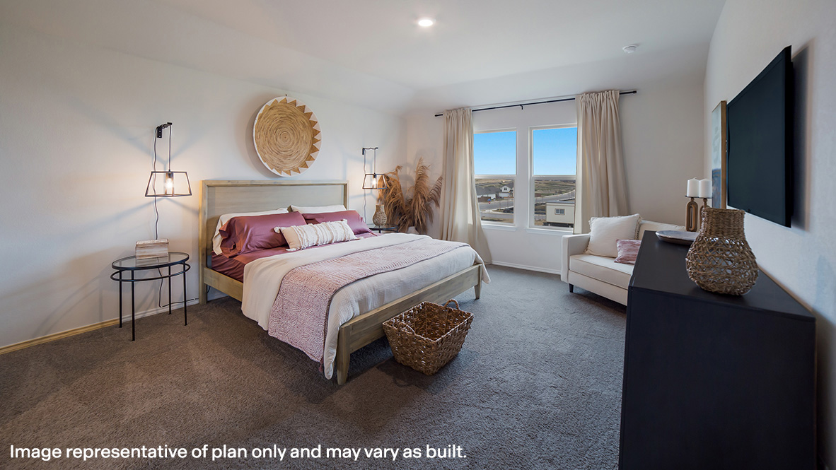 Spacious primary bedroom with quality carpet and ensuite bathroom.