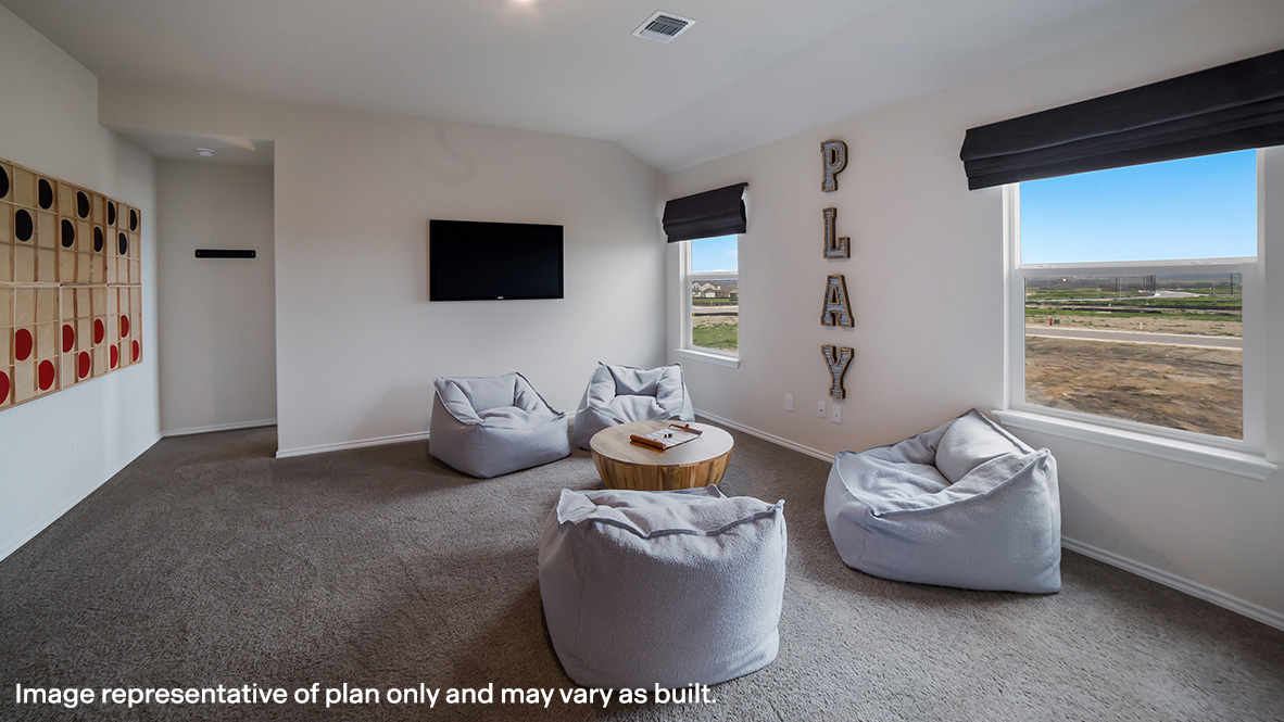 Spacious, open-concept loft at top of staircase with quality carpet and windows.