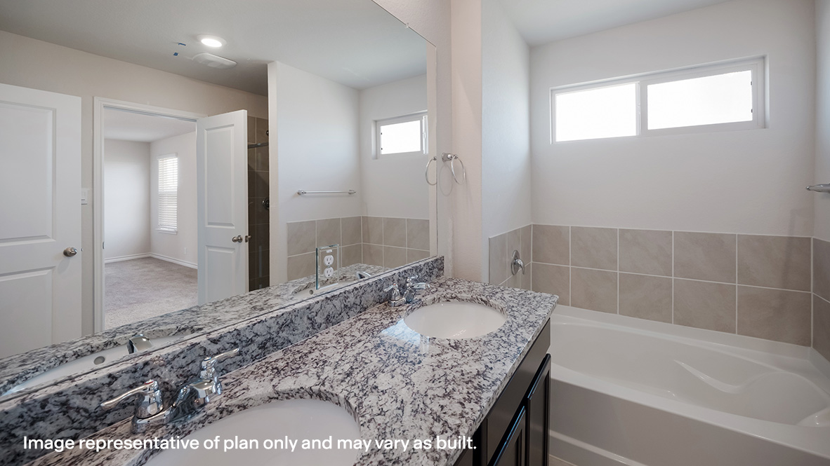 Primary bathroom with water closet and spacious walk-in closet.