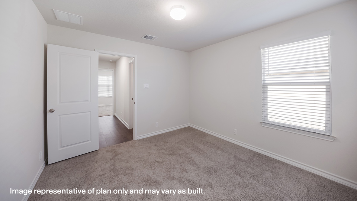 Third bedroom with quality carpet, window and closet.