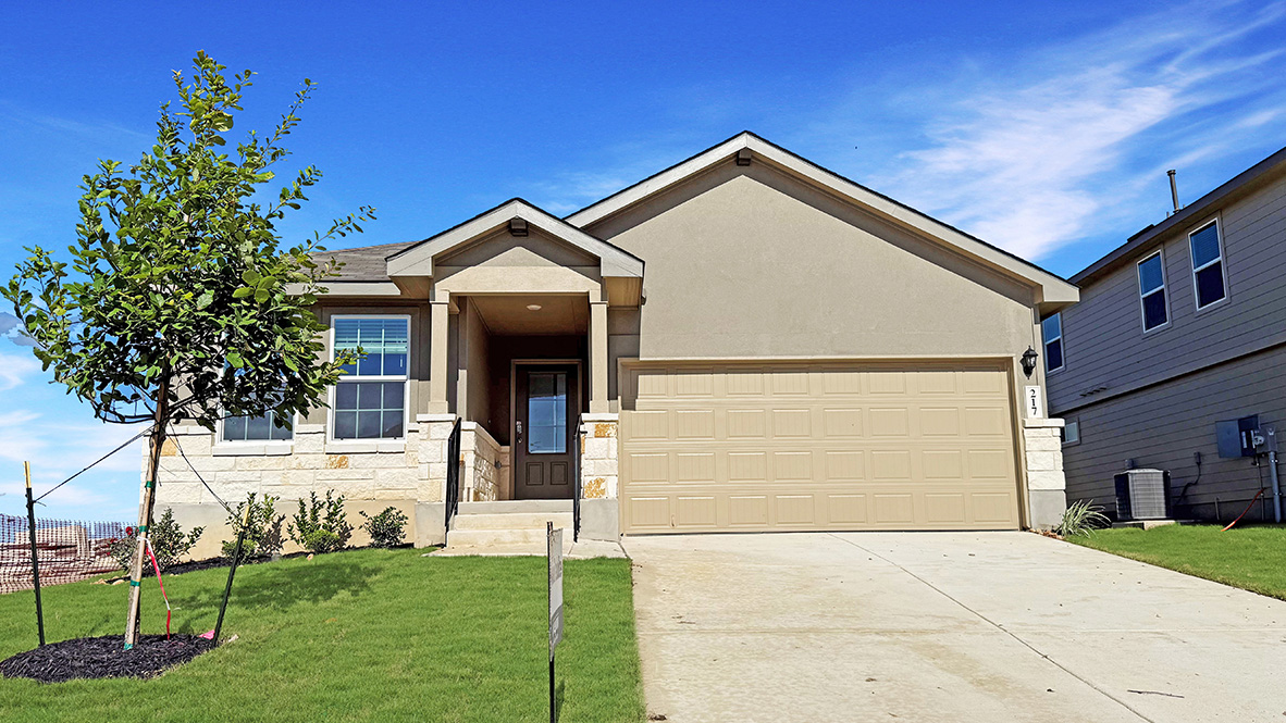 One story home with covered porch, brick front exterior and two car garage.