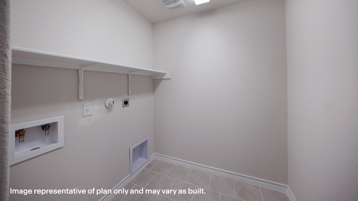 Spacious utility room with shelving.