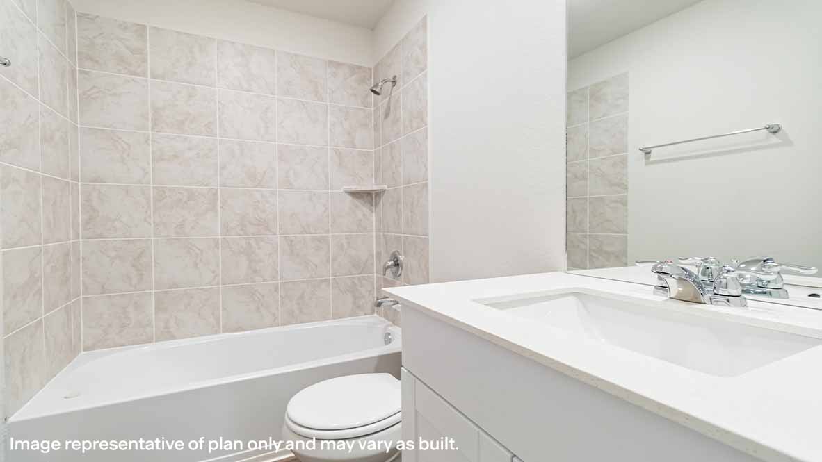 Bathroom with a sink, a mirror, and a shower with a bathtub