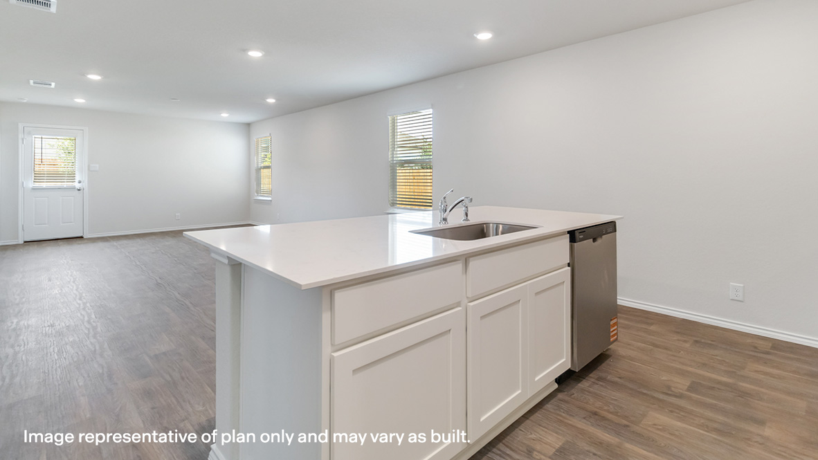Spacious kitchen island overlooking blended dining area and living room.