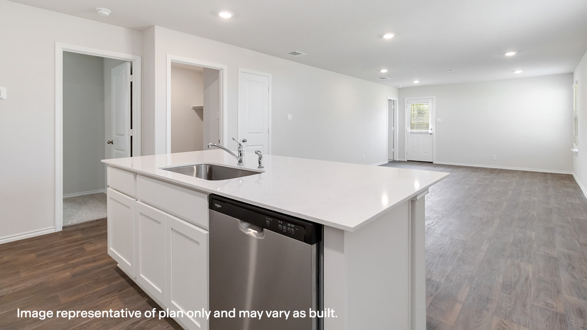Kitchen island with stainless steel dishwasher overlooking open concept dining area and living room.