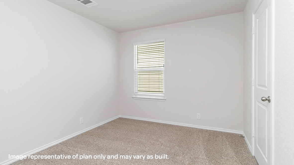 Third bedroom with carpet flooring and window.