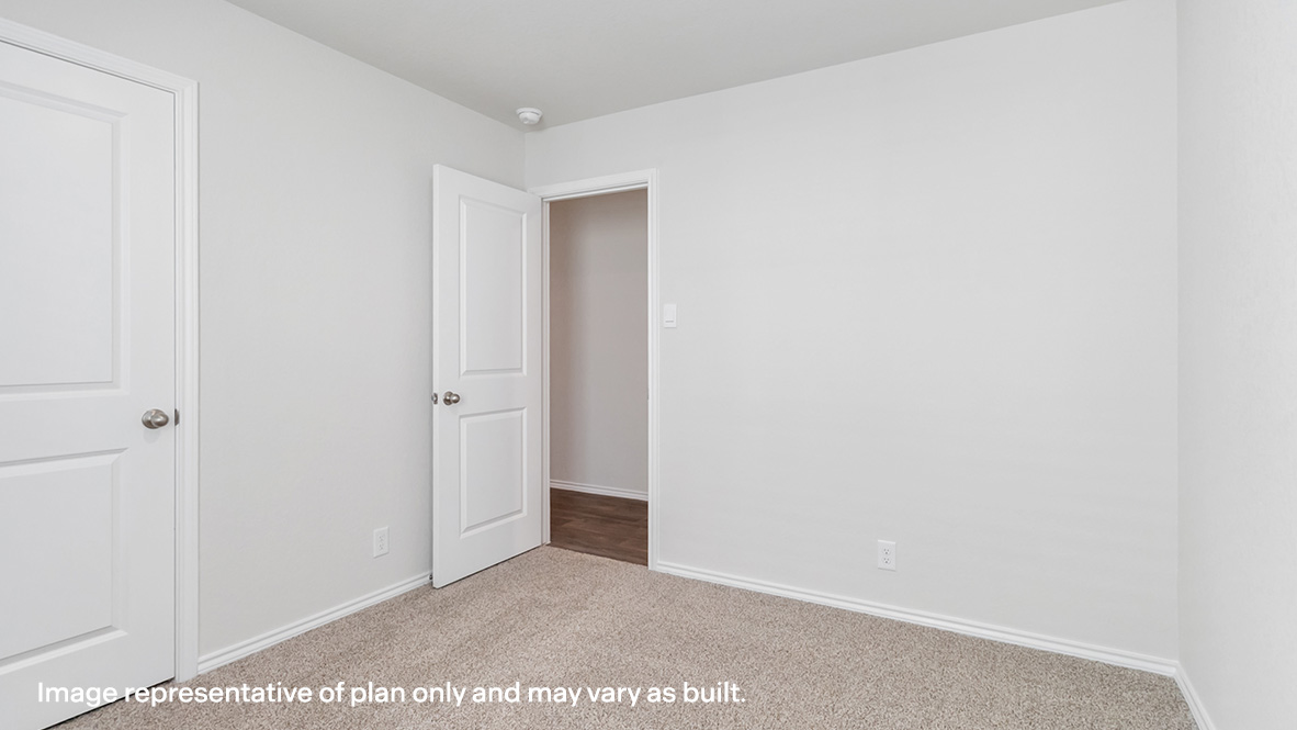 Third bedroom with carpet flooring and closet.