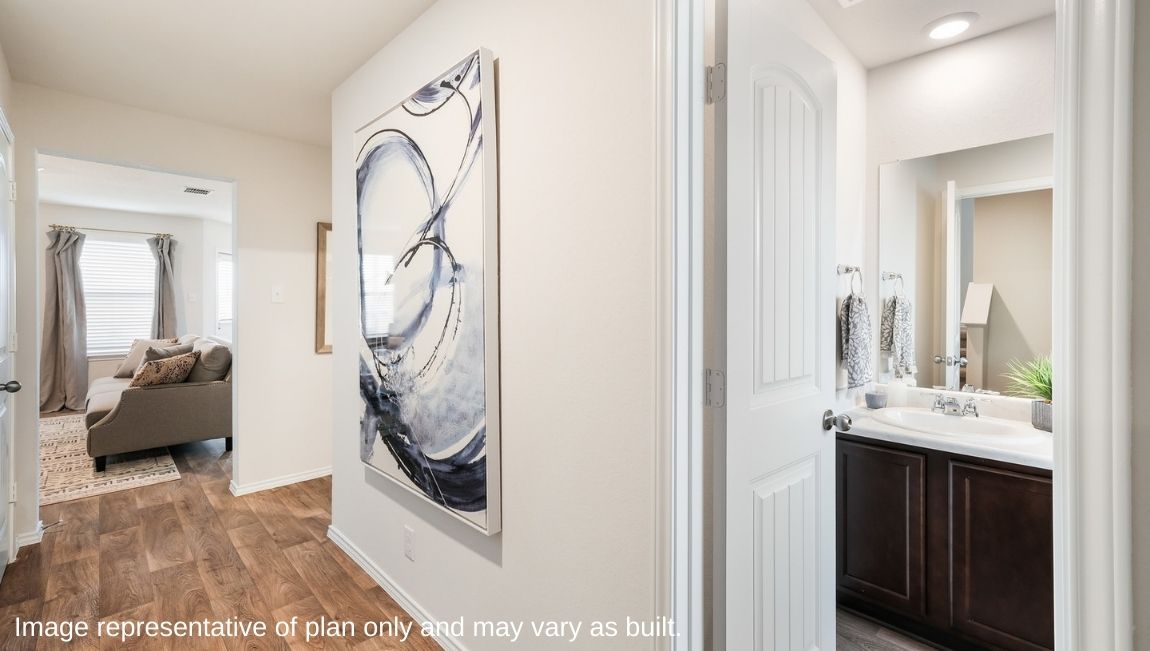 Entryway leading into powder bathroom and living area.