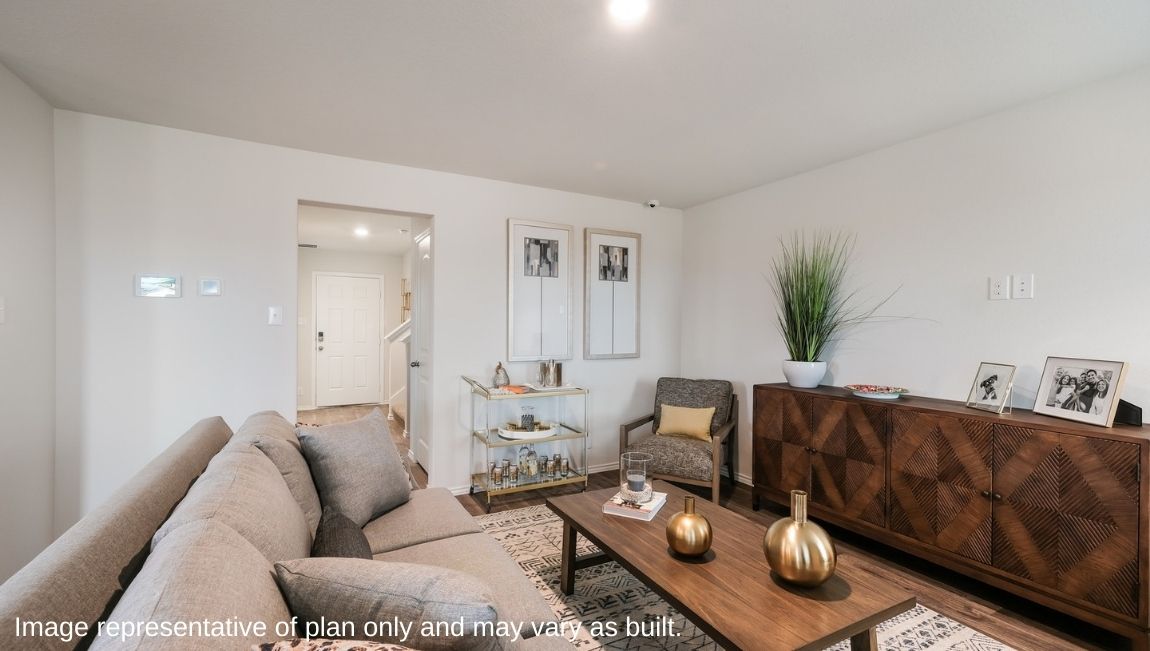 Spacious living area with hard surface flooring off the foyer.