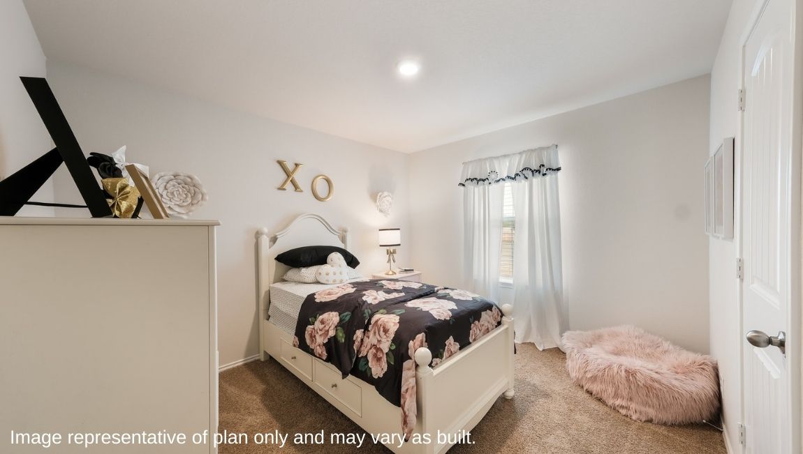 Secondary bedroom with quality carpet, window and closet.