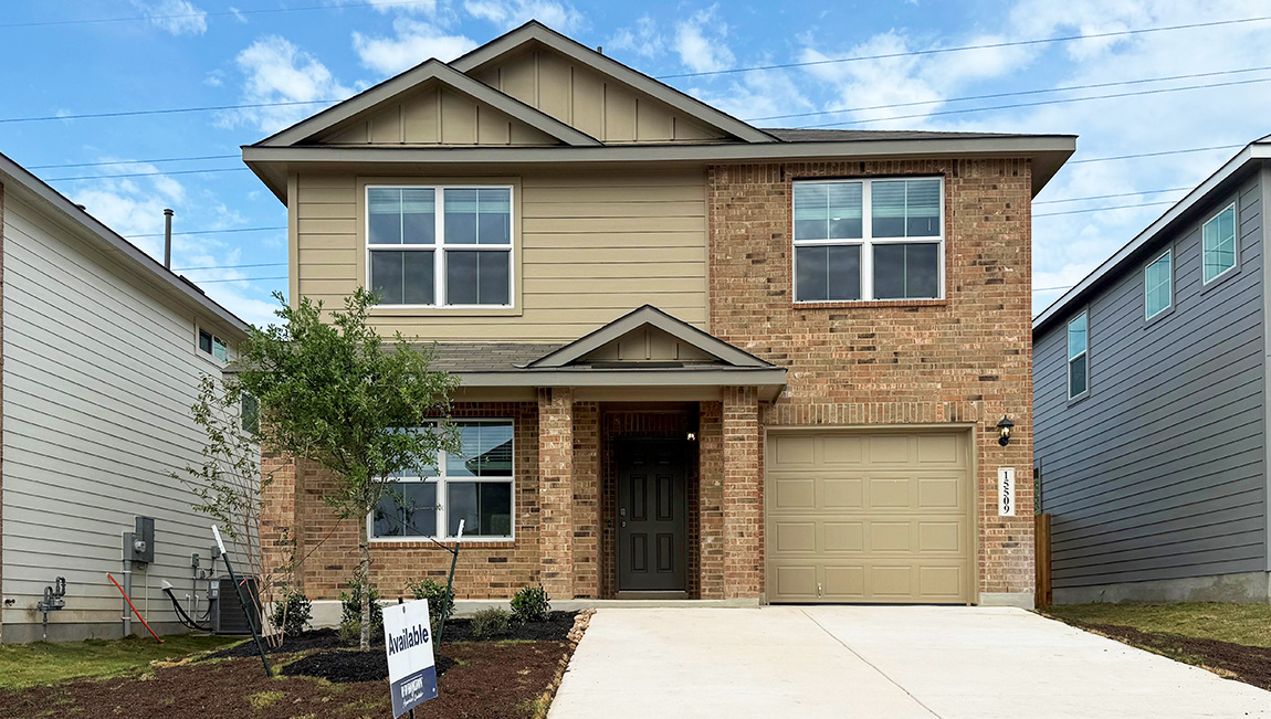 15509 laughing owl 2 story home with brick and siding front exterior and 1 car garage