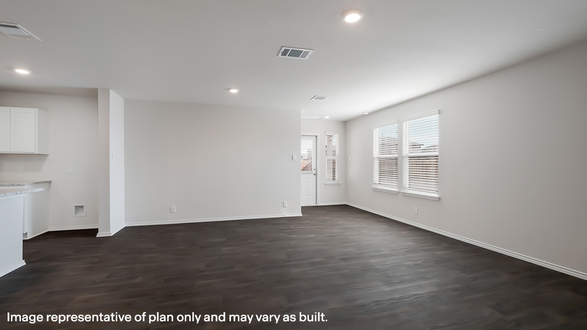 Open concept living room and dining area with hard surface flooring throughout.