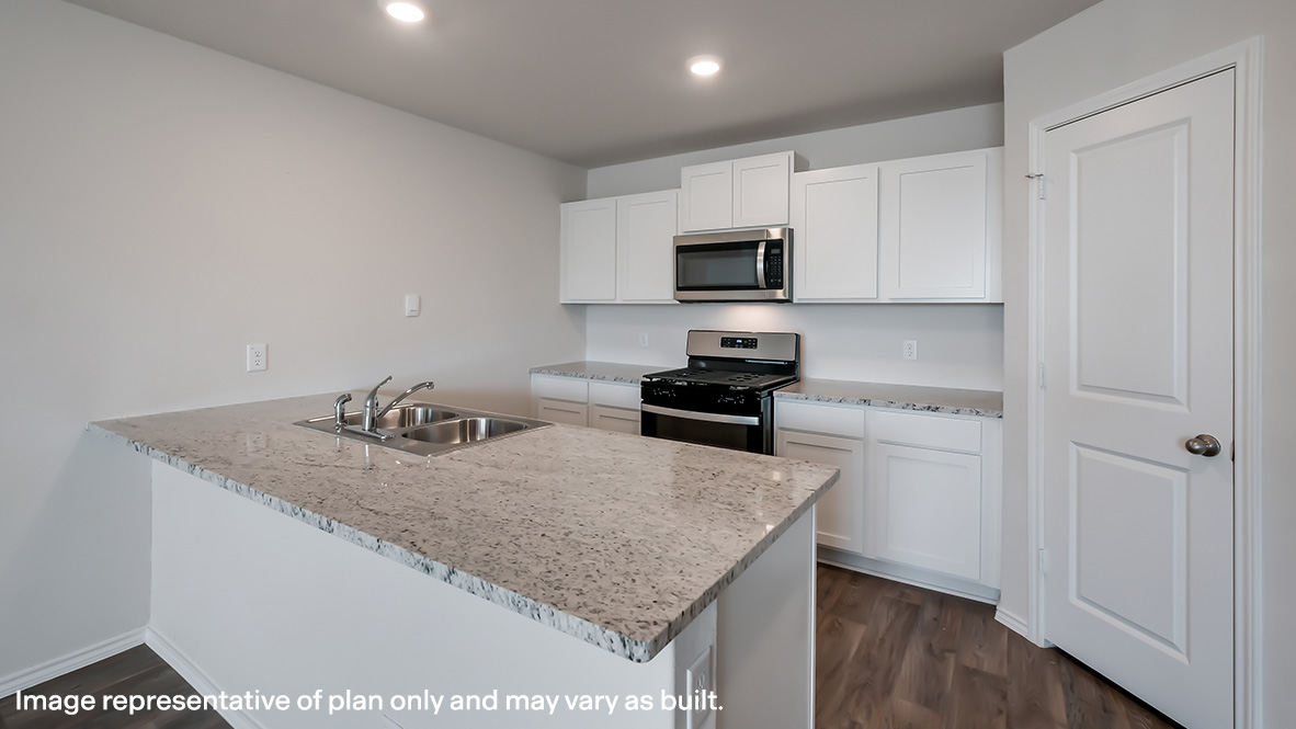 Kitchen with quartz or quartz countertops, stainless steel appliances and a spacious corner pantry.