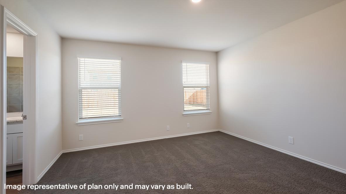 Spacious primary bedroom with ensuite bathroom, quality carpet flooring and large windows.