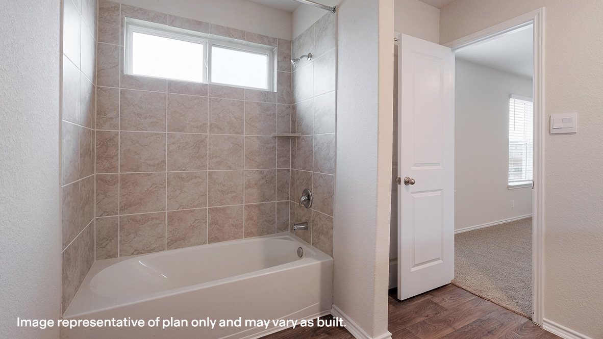 primary ensuite bathroom with tub and shower combo