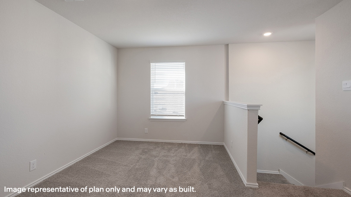 Open concept living room flowing into dining area and kitchen with hard surface flooring and large windows throughout.