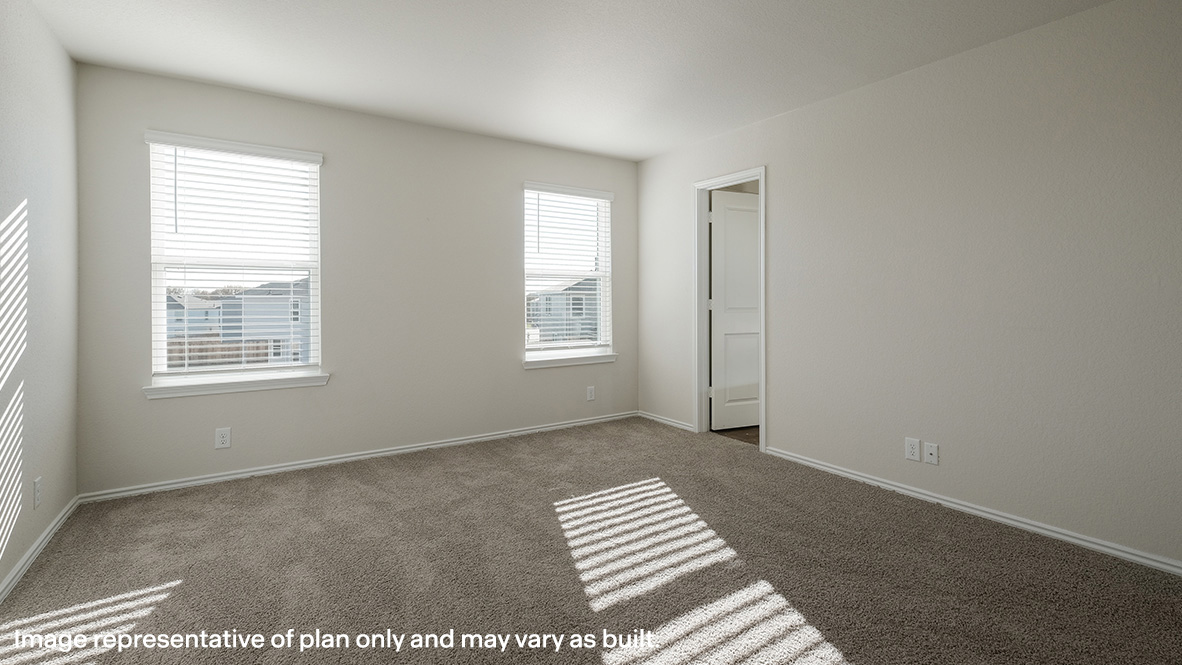 Spacious upstairs primary bedroom with quality carpet, large windows and ensuite bathroom.