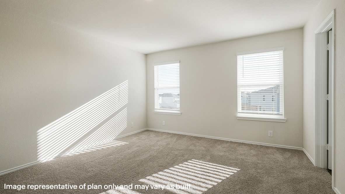 Spacious upstairs primary bedroom with quality carpet and large windows and blinds.