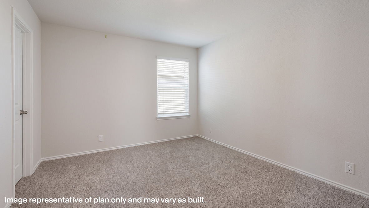 Secondary bedroom with quality carpet, window and closet.