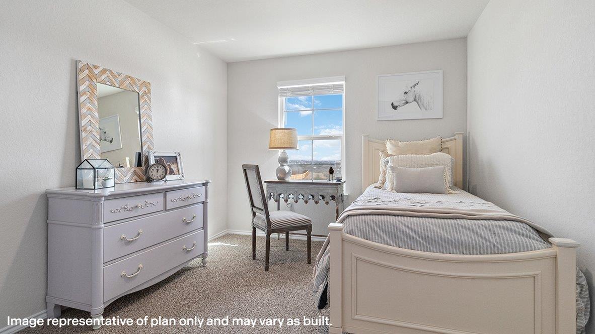 Fourth bedroom with carpet, window and closet.