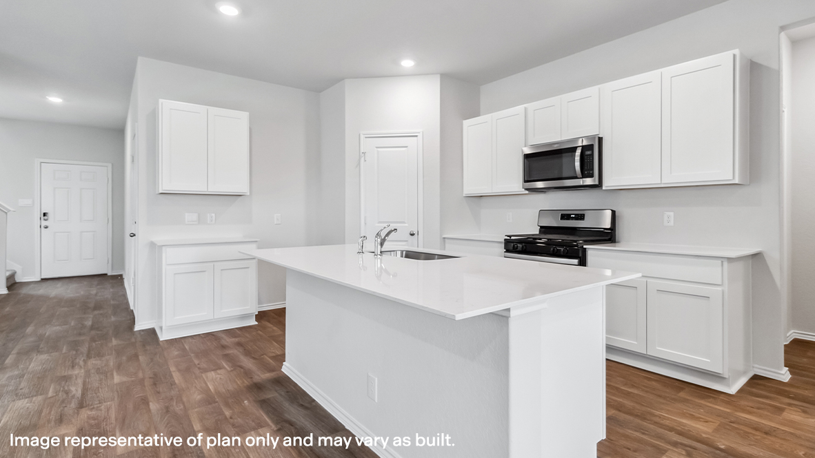 Spacious, open-concept kitchen with island, shaker style cabinets and granite or quartz countertops.
