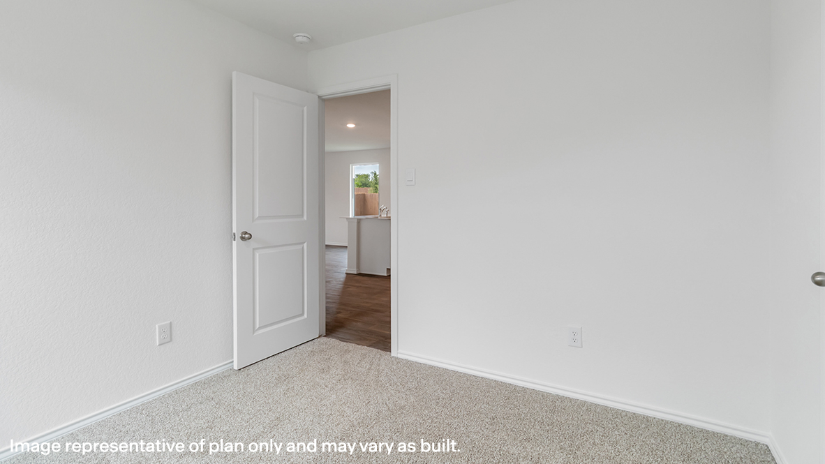 Bedroom with carpeted floors.