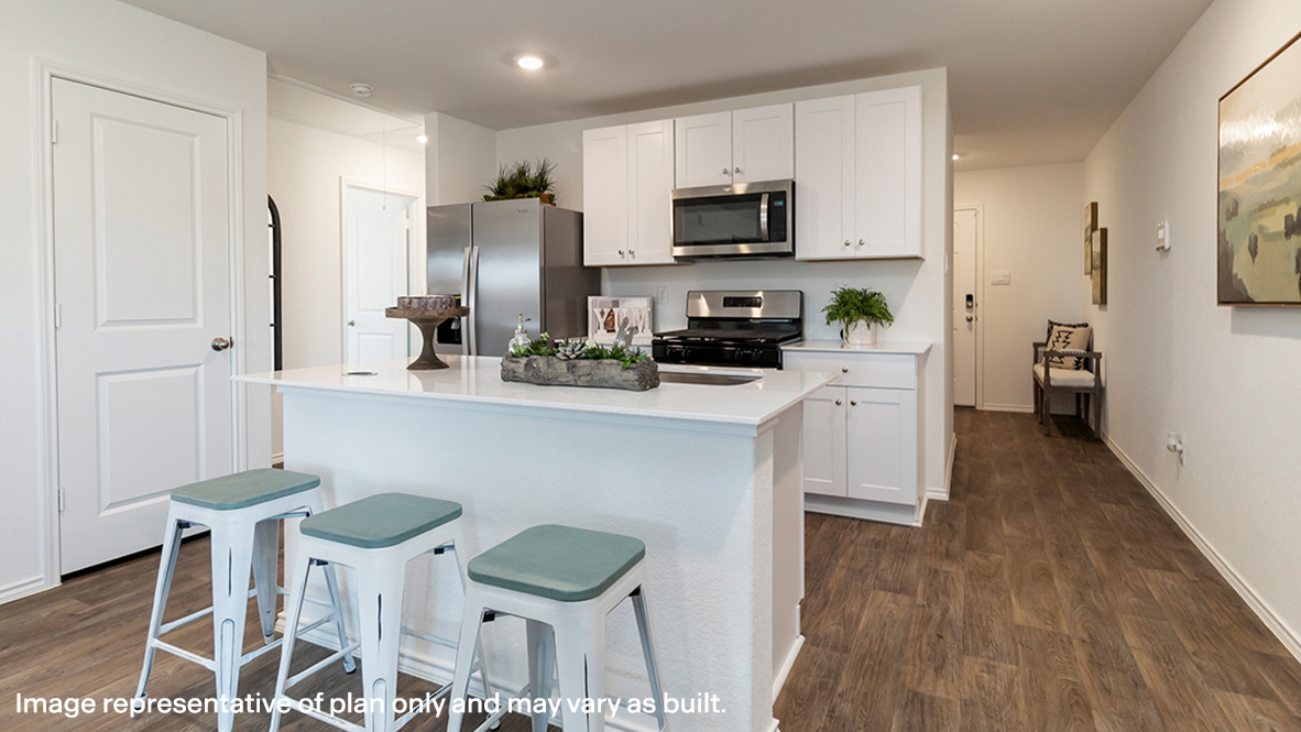 Kitchen with a quartz island.