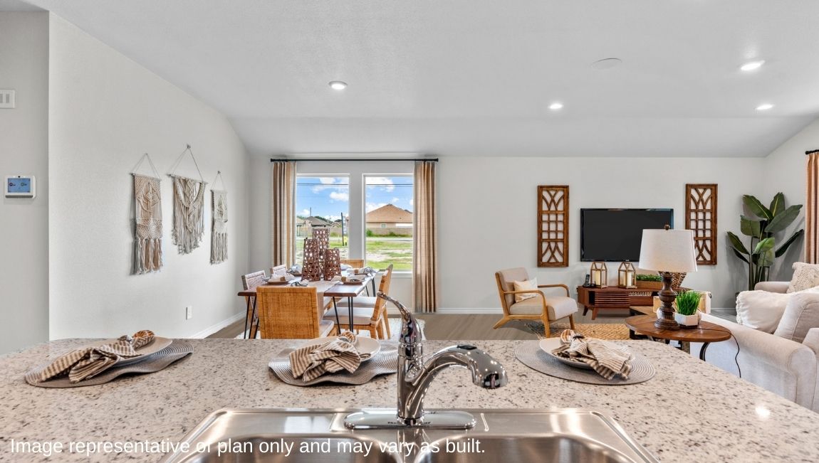 kitchen island overlooking open concept dining area and living area