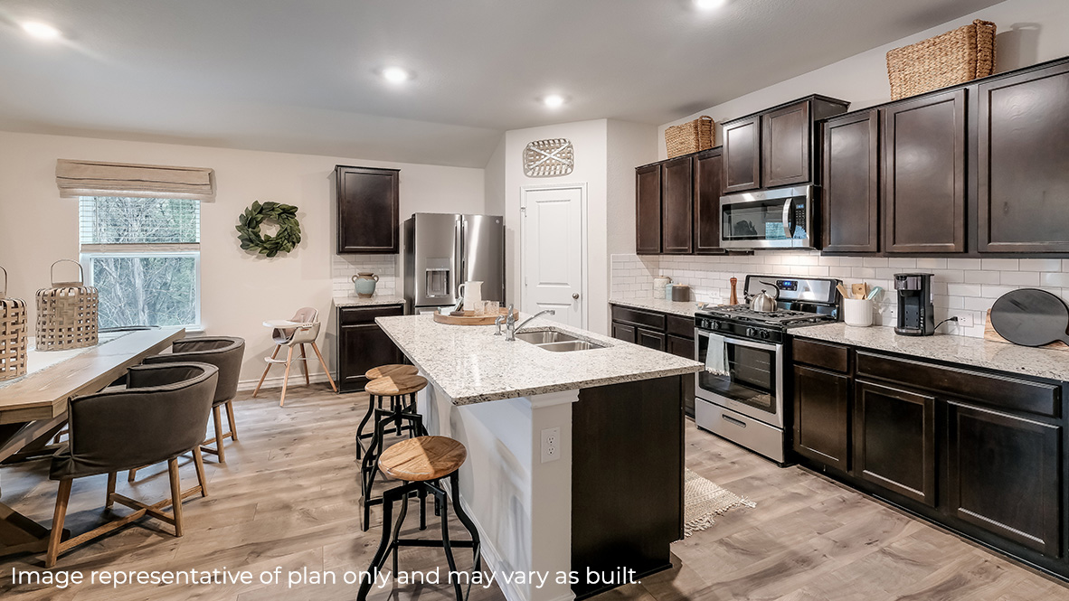 kitchen with stainless steel appliances, large kitchen island and corner pantry